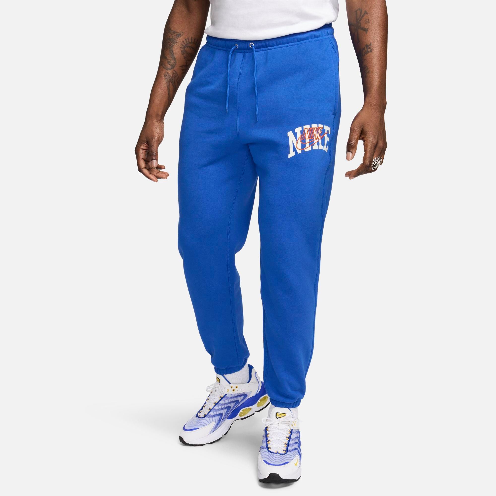 Shop Nike Men's Club Fleece Arched Varsity Graphic Cuffed Sweatpants In Game Royal/safety Orange