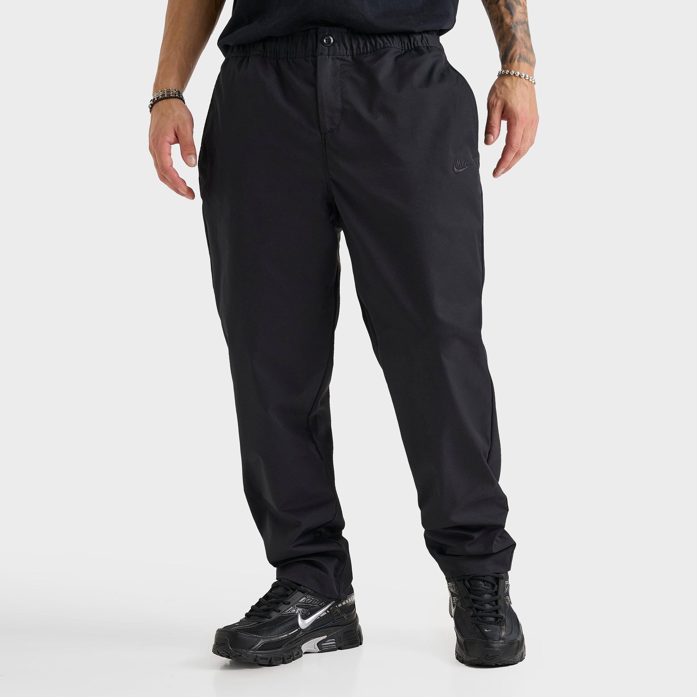 Nike Men's Club Woven Tapered Pants in Black Size: XS