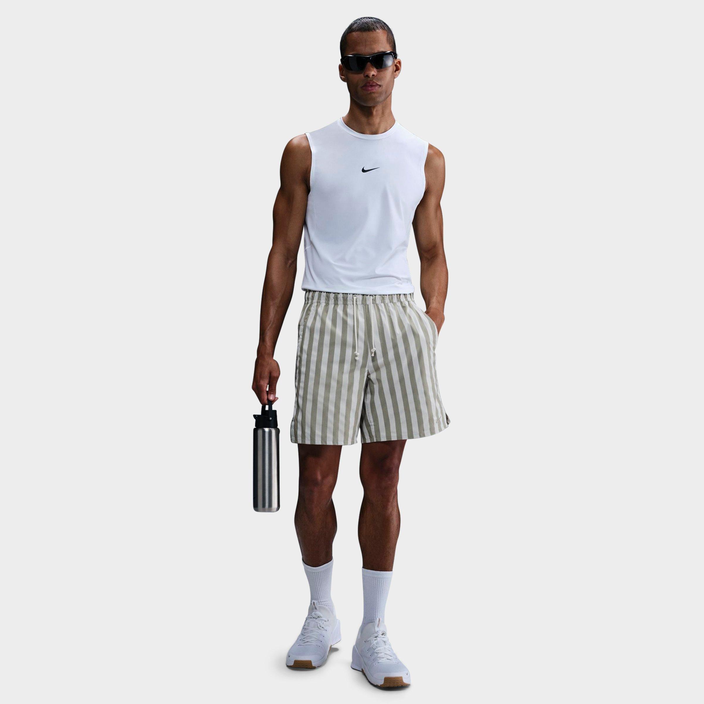 Nike Men's Unlimited Dri-FIT Striped 7" Unlined Versatile Shorts in Light Army/Ltbone/Li Size: XS