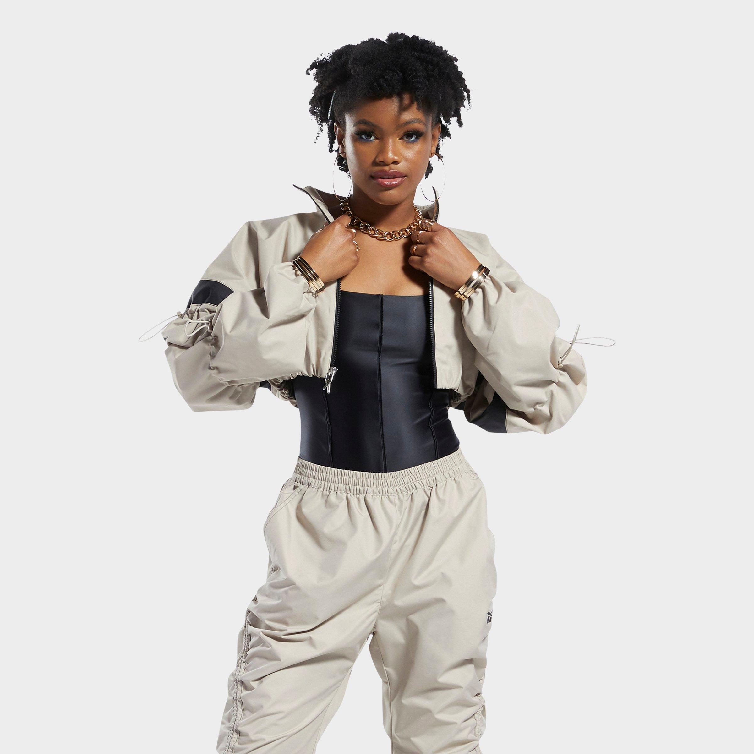 UPC 195746458069 product image for Reebok Women's Cardi B Woven Crop Jacket in Off-White/Modern Beige Size Large Po | upcitemdb.com