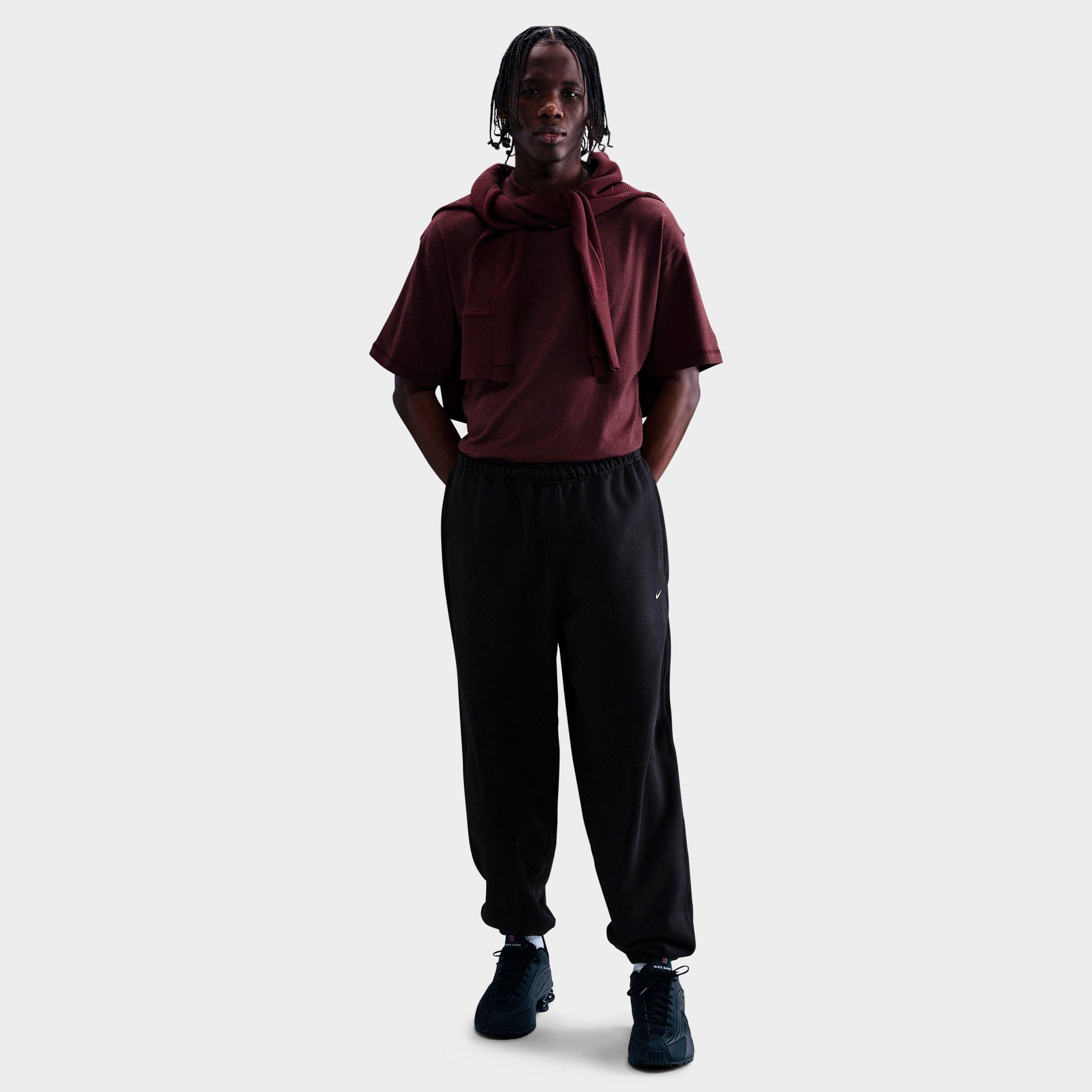 Nike Men's Solo Swoosh Cuffed Fleece Pants in Black/White Size: XS
