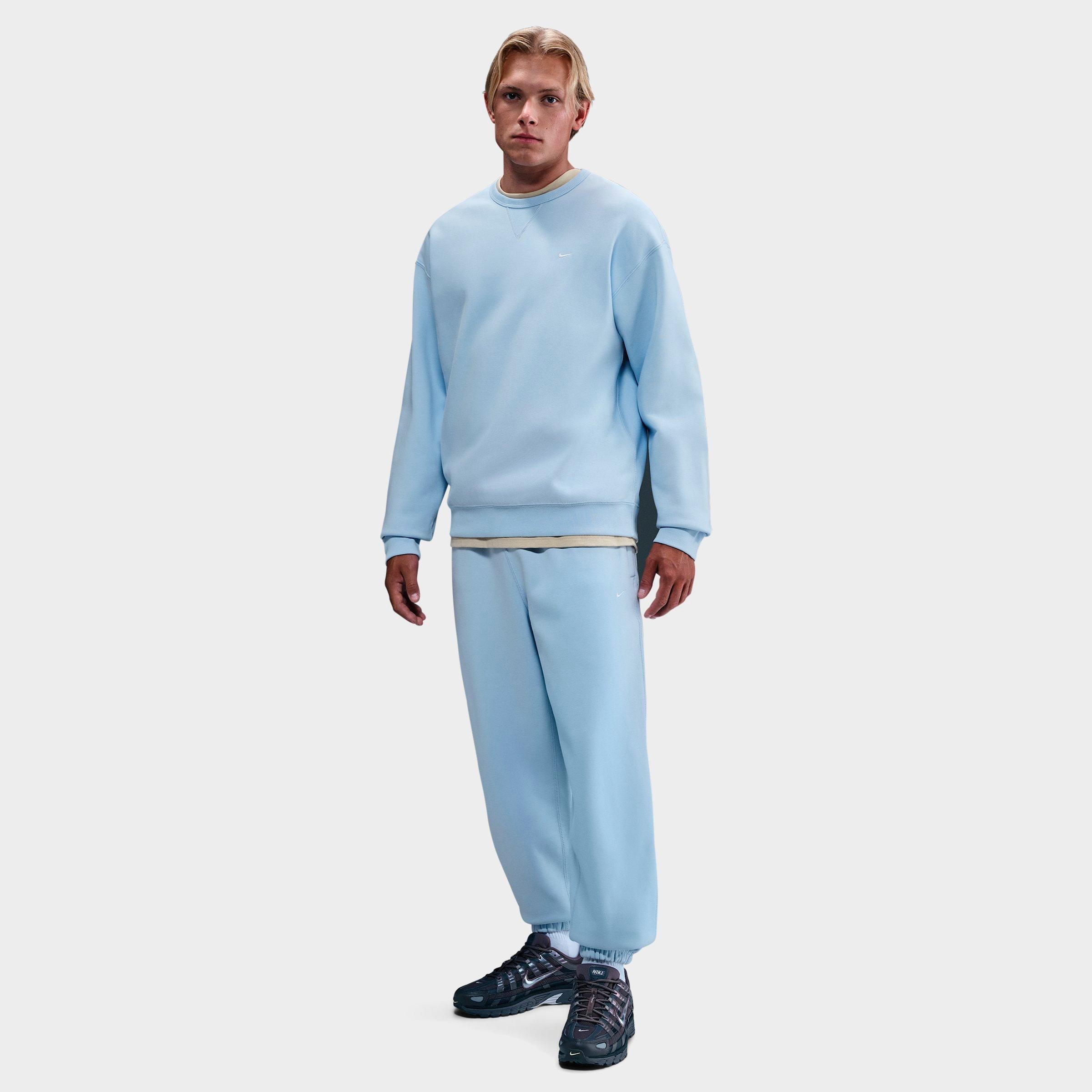 Nike Men's Solo Swoosh Cuffed Fleece Pants in Celestine Blue/Celestine Blue/White Size: XS