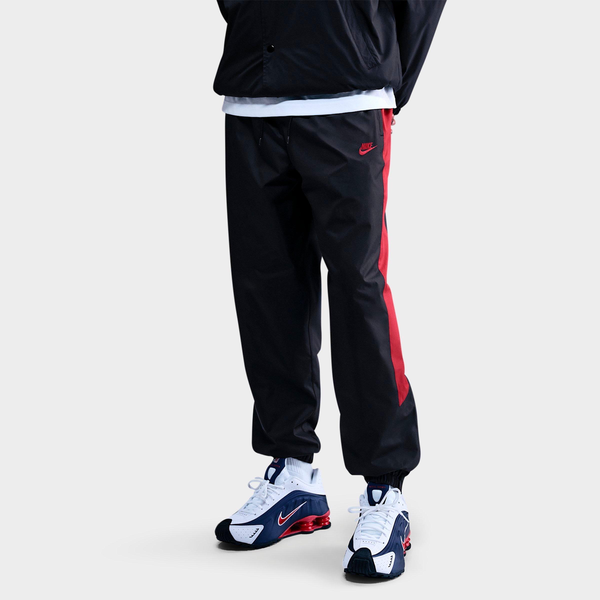 Nike Men's Windrunner Lined Pants in Black/Team Crimson/Team Crimson Size: XL Tall