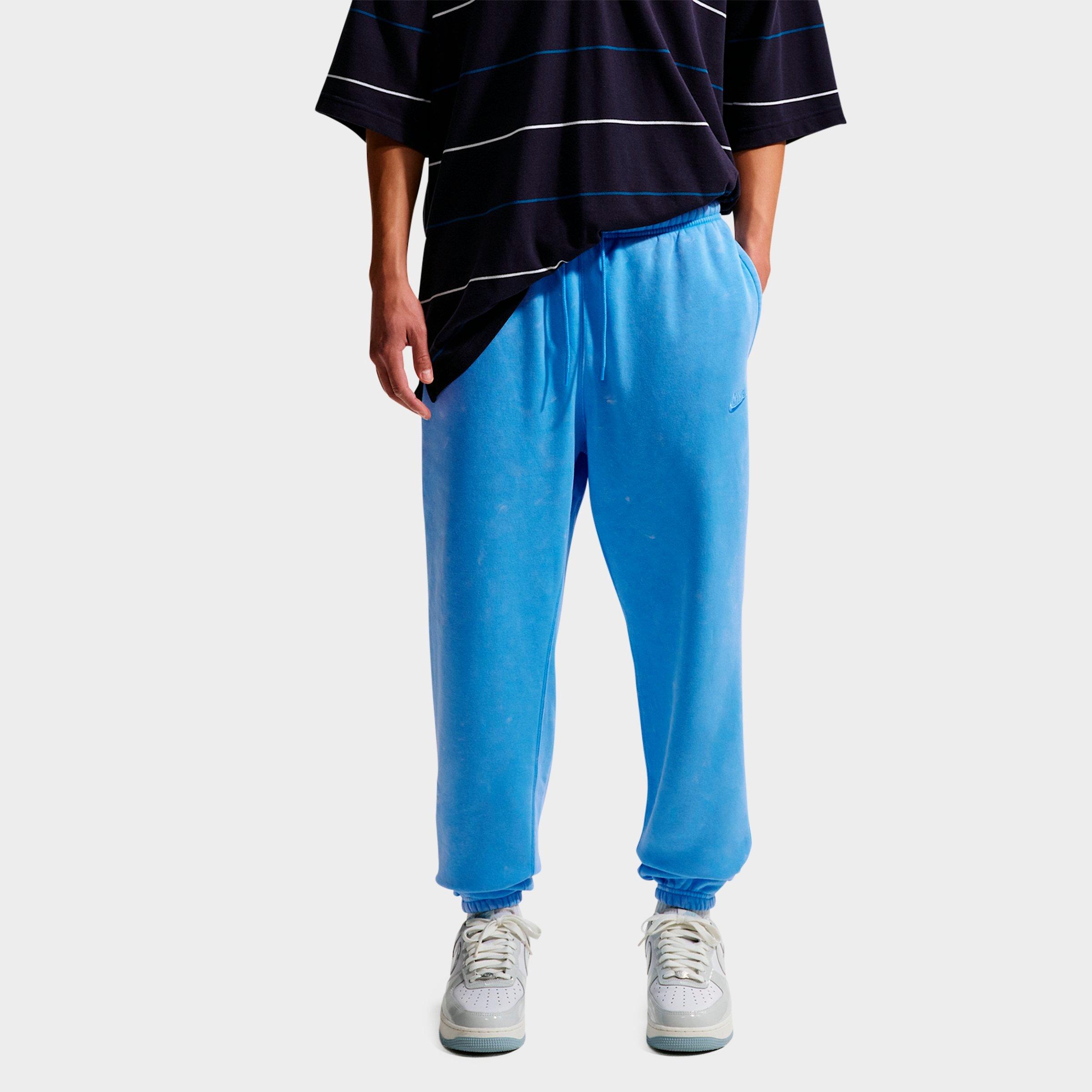 Nike Men's Sportswear Club Washed Cuffed Fleece Pants in University Blue Size: Large