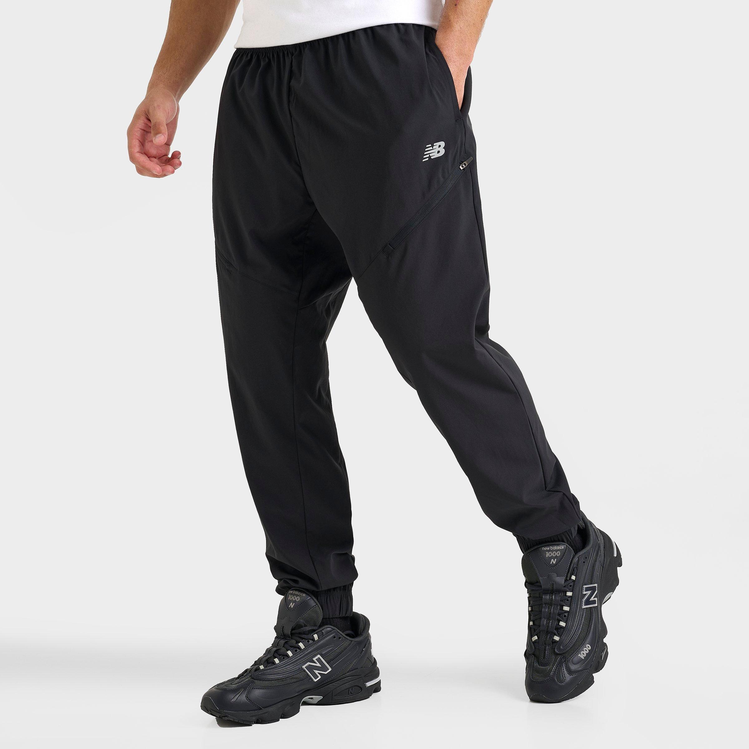 New Balance Men's Woven Zip Pocket Jogger Pants in Black/Black Size Small
