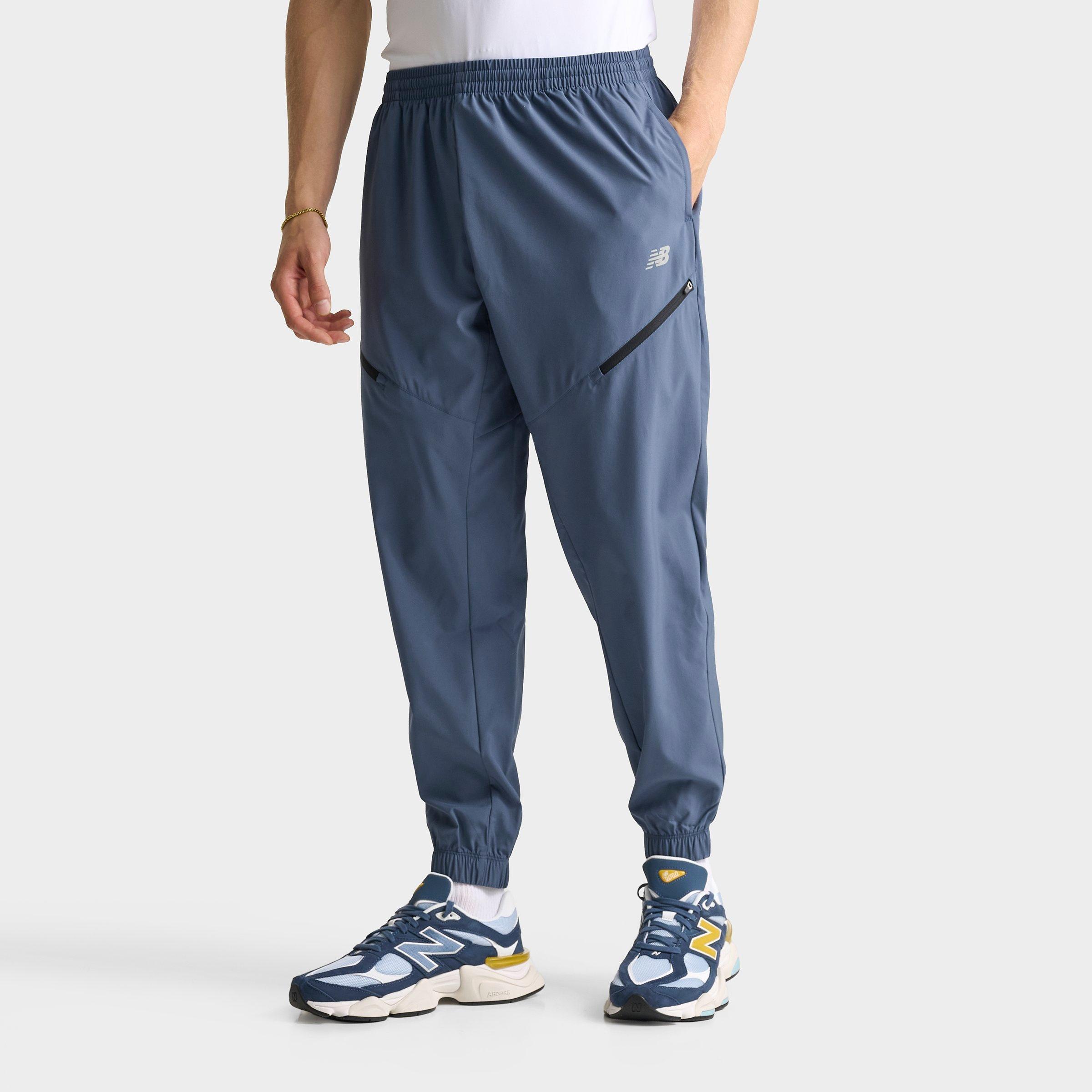 New Balance Men's Woven Zip Pocket Jogger Pants in Navy/Vintage Indigo Size: Small