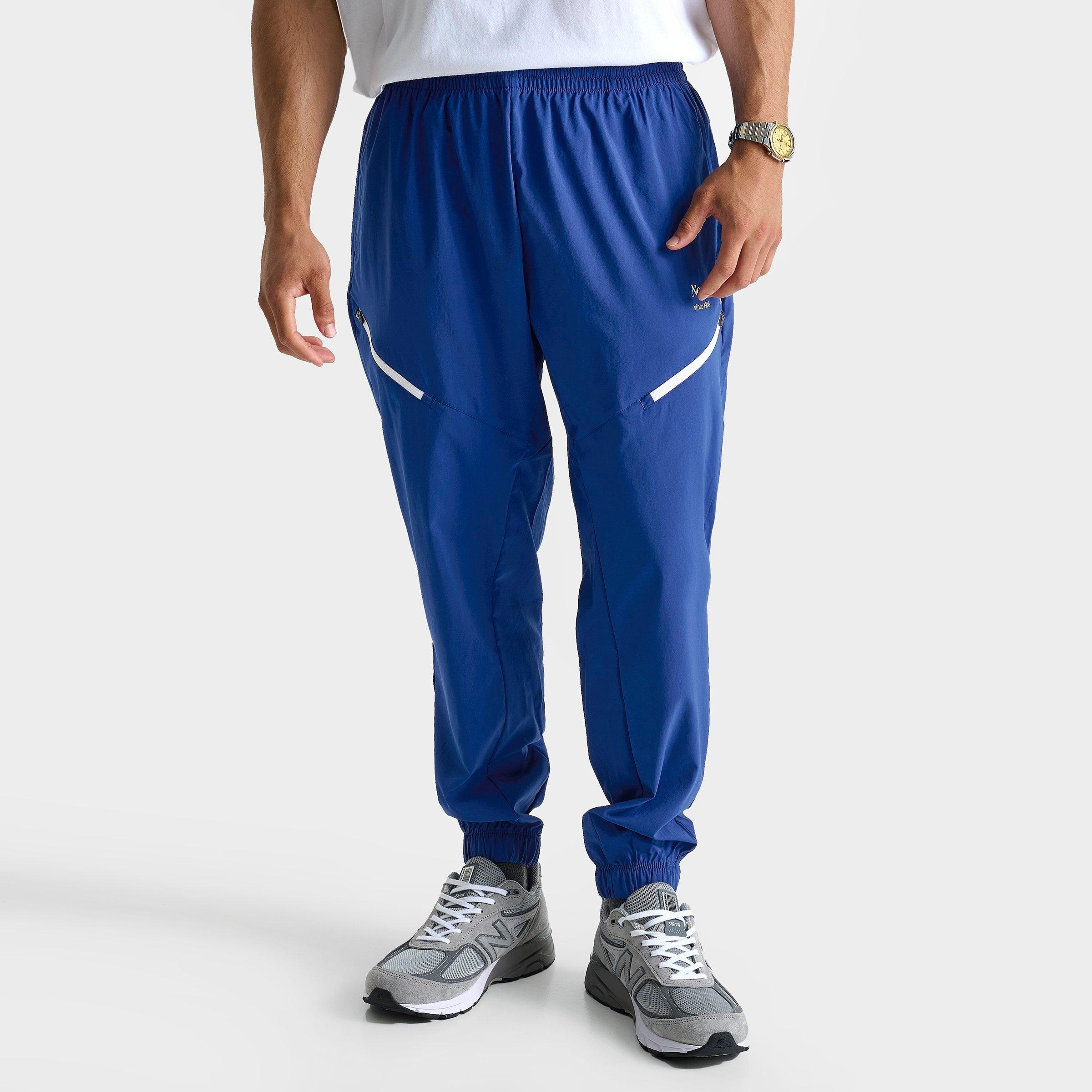 New Balance Men's Reimagined Woven Track Pants in Navy/Blue Size: Small